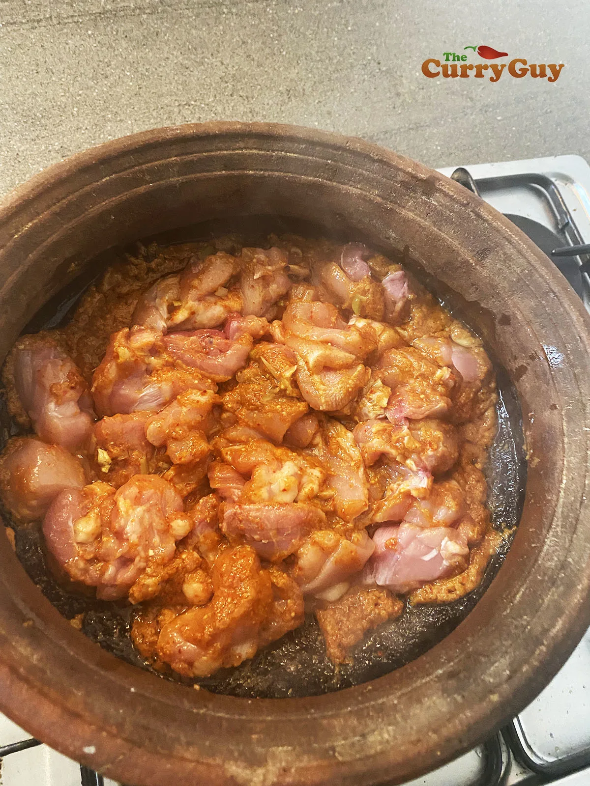Adding chicken to pot