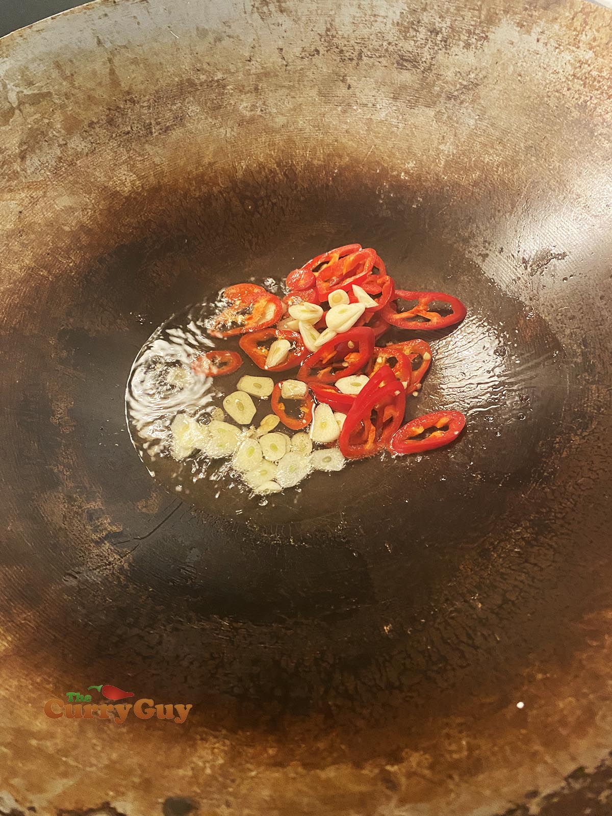 Frying garlic and chillies.