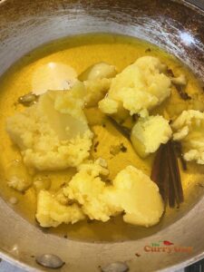 Melting ghee with spices