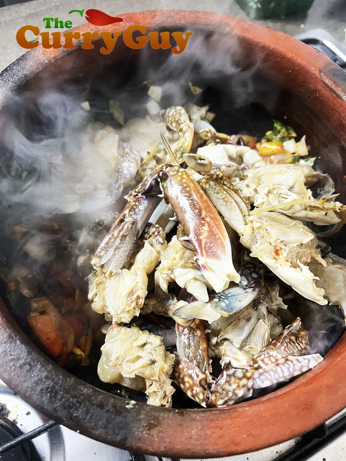 Adding the crab to the pan.