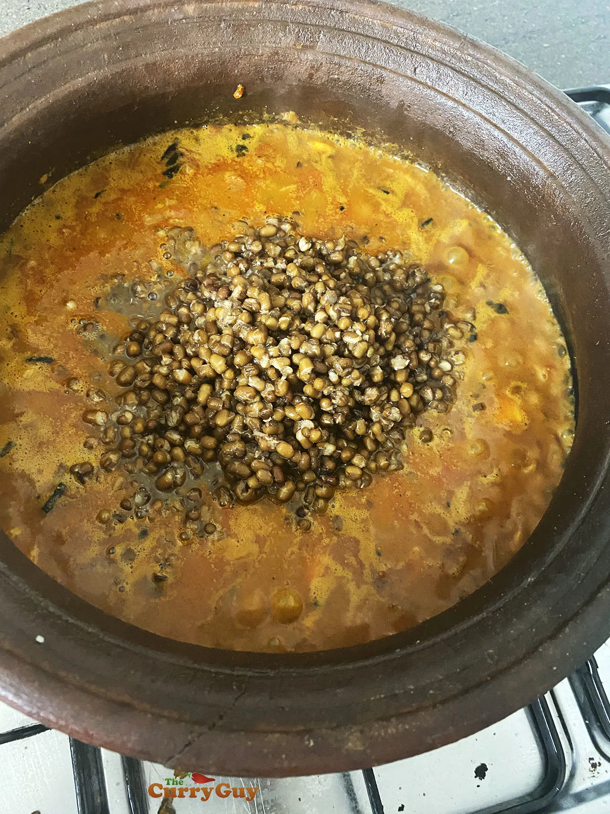 Adding lentils to the pan