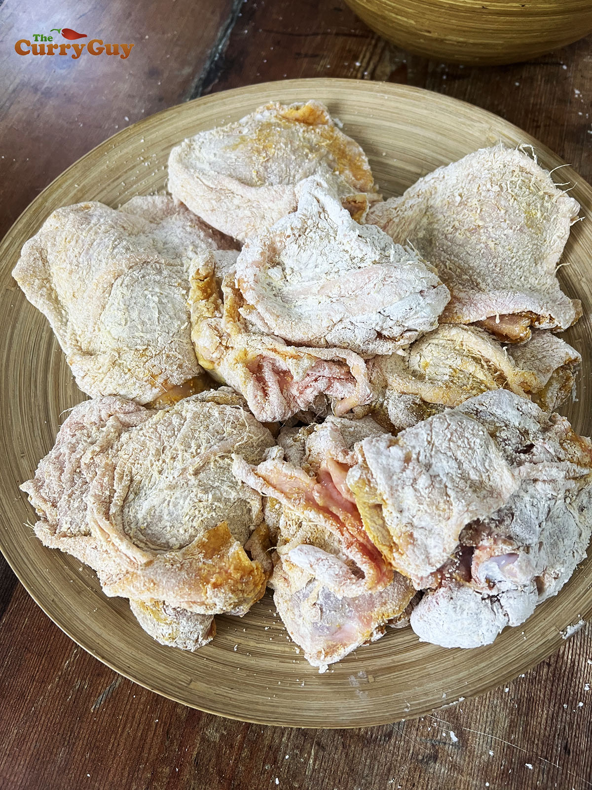 Rubbing chicken with turmeric, salt and cornflour (corn starch)