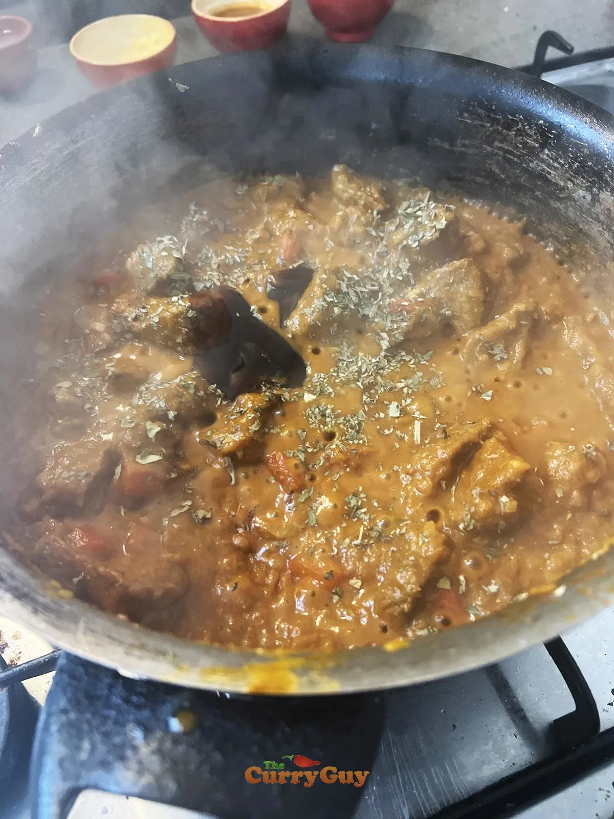 Adding tamarind and kasoori methi to pan