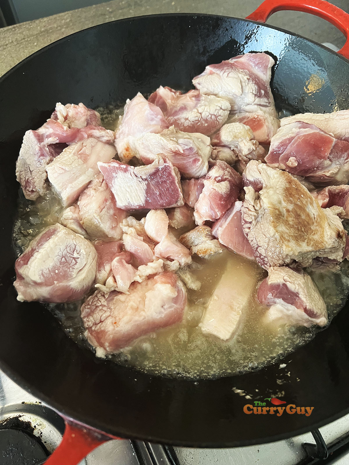 Pork meat cooking in pork lard