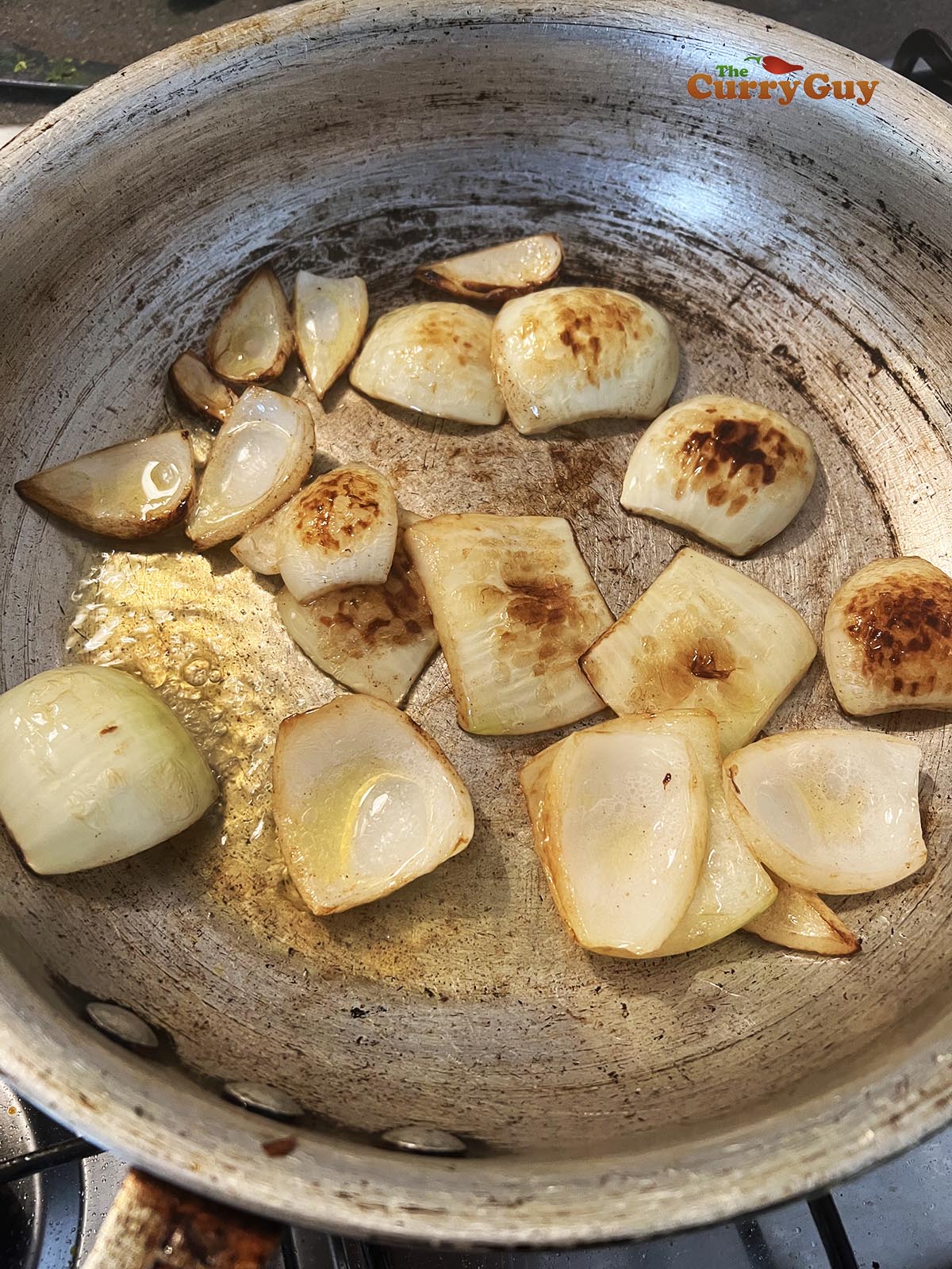 Charring the onion petals in the pan