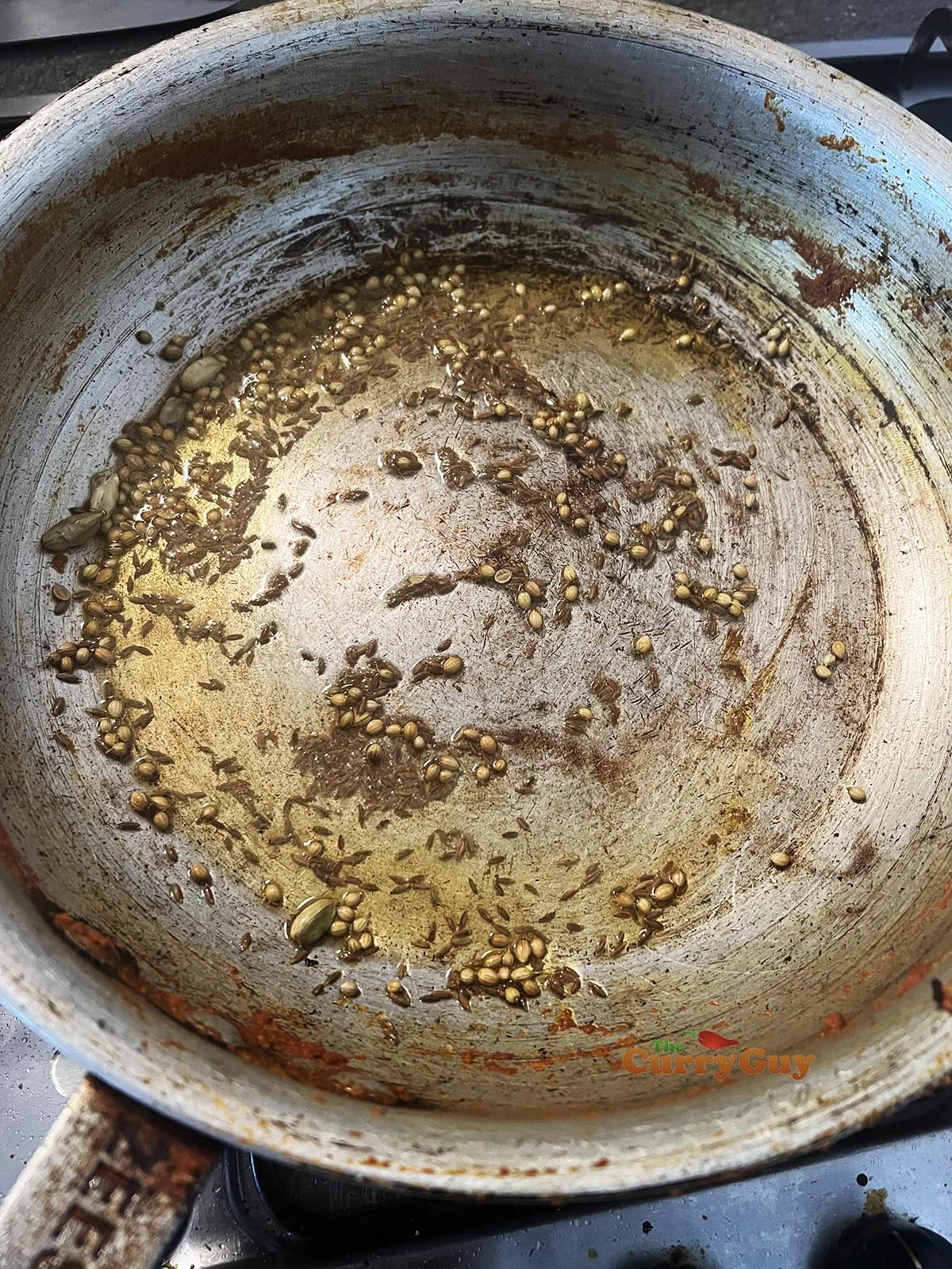Infusing whole spices in oil.