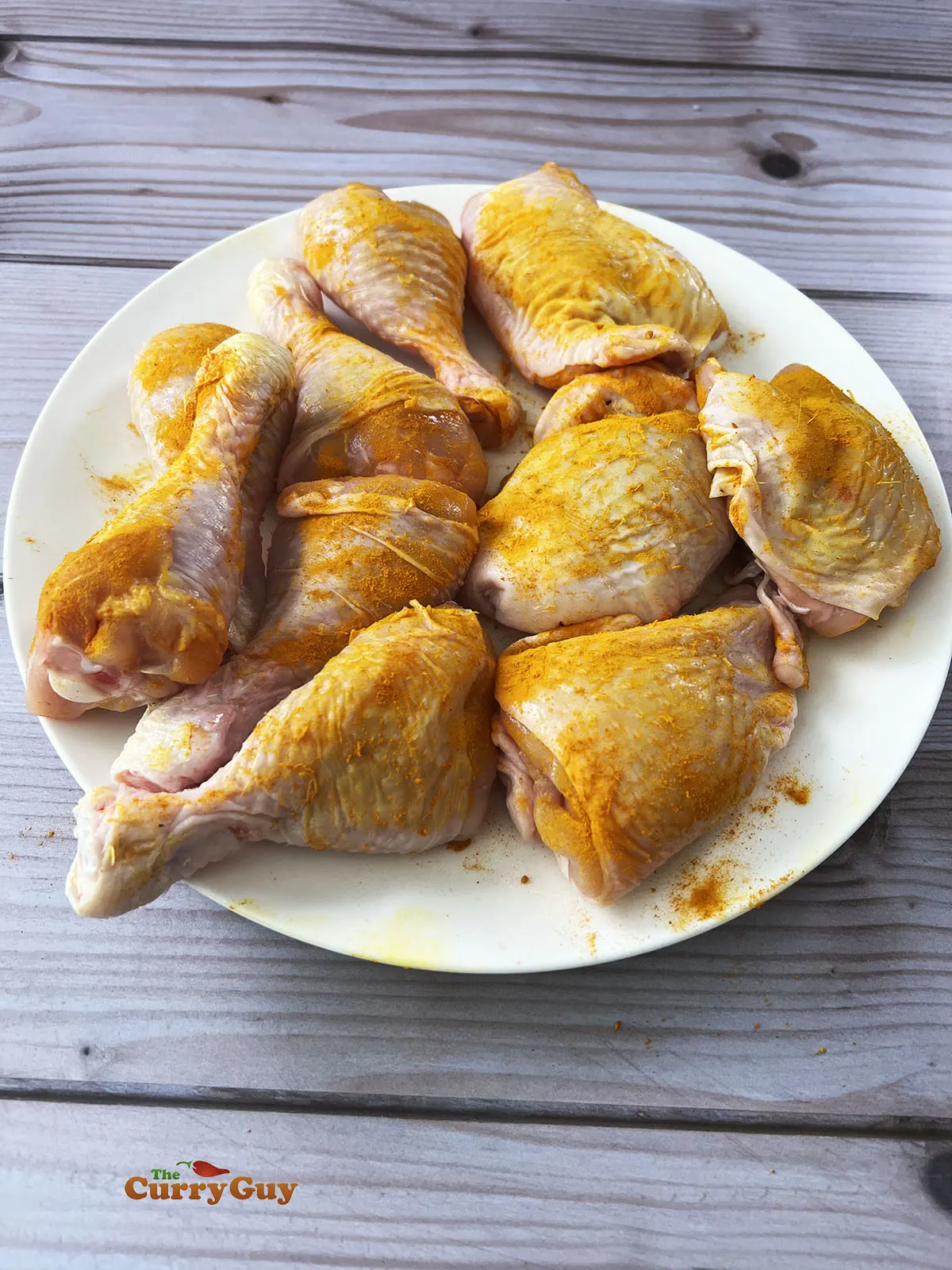 Chicken with turmeric rubbed into the skin