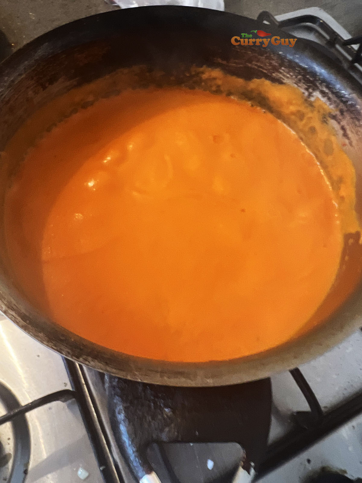 Simmering the smooth sauce in the pan