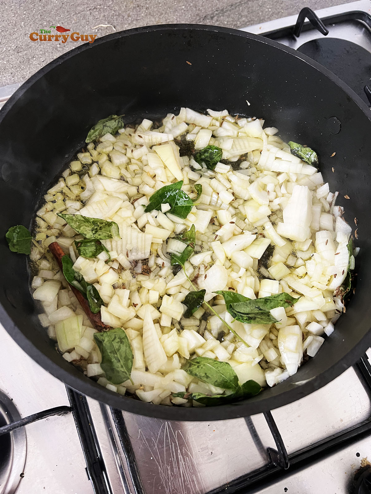 Adding onions to the pan