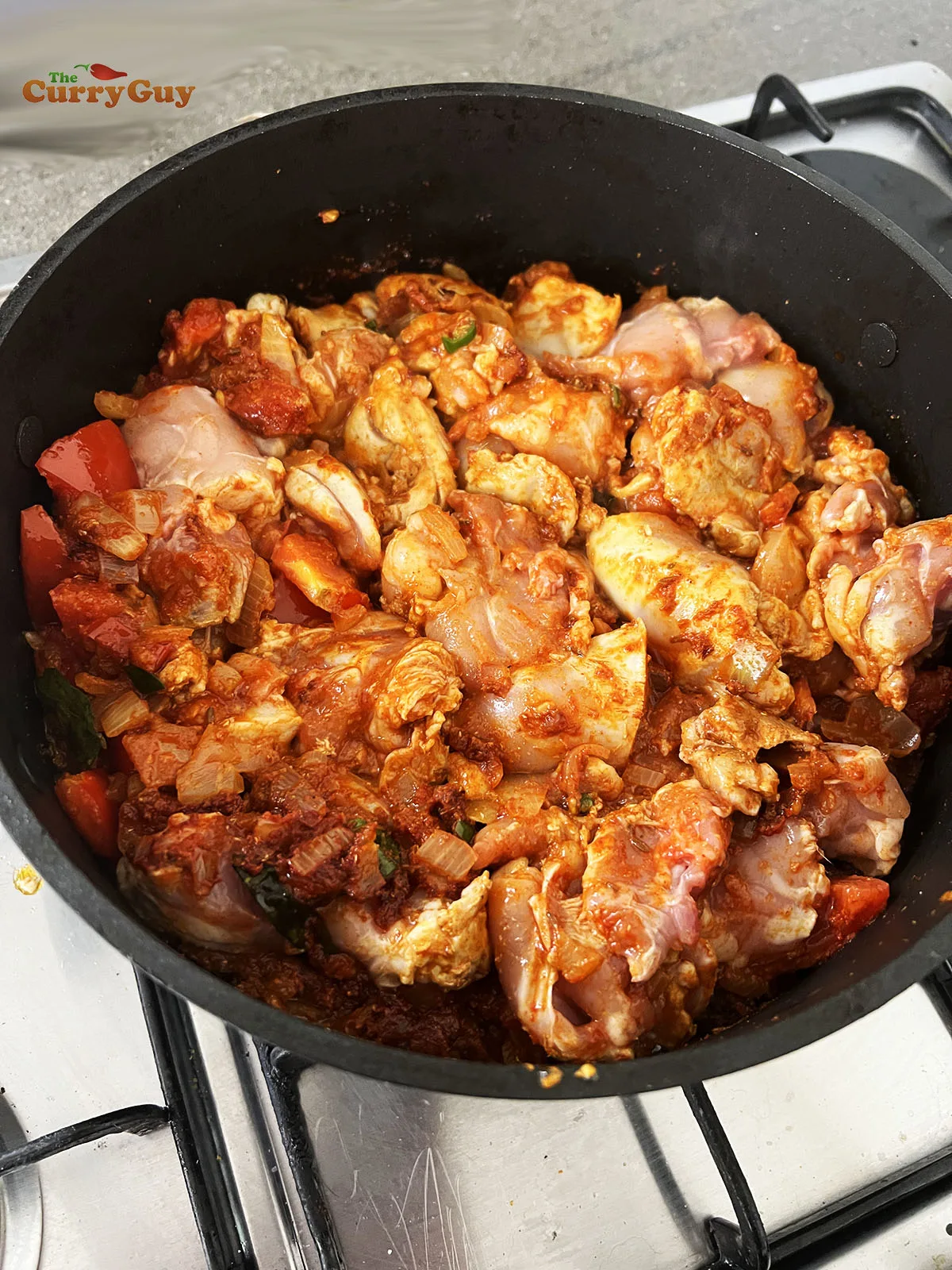 Adding chicken to the pan