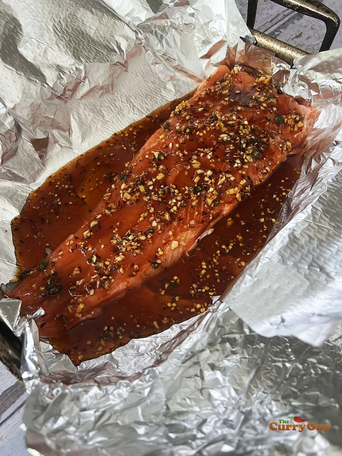 Salmon covered with sauce ingredients