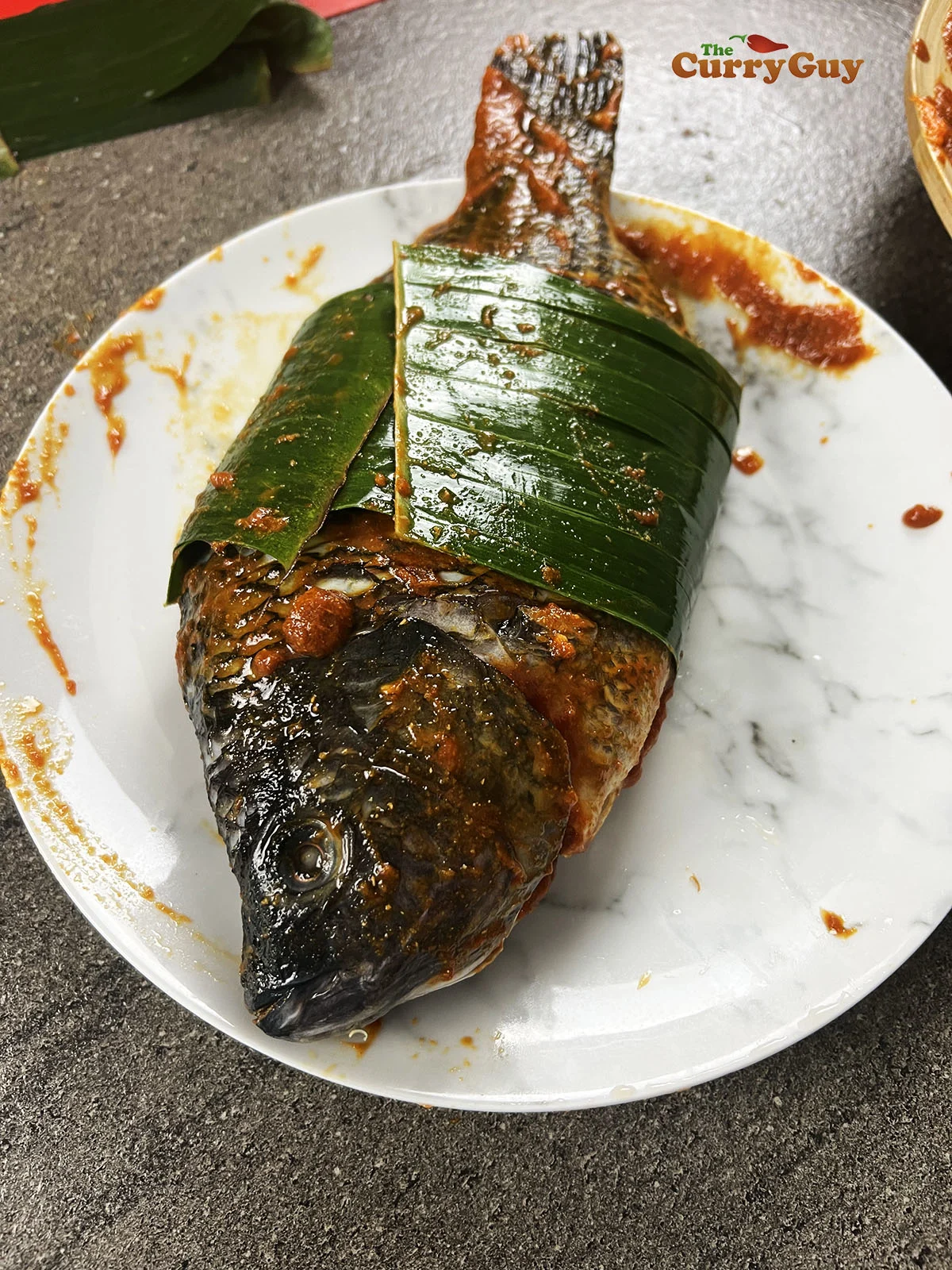 fish wrapped in banana leaf