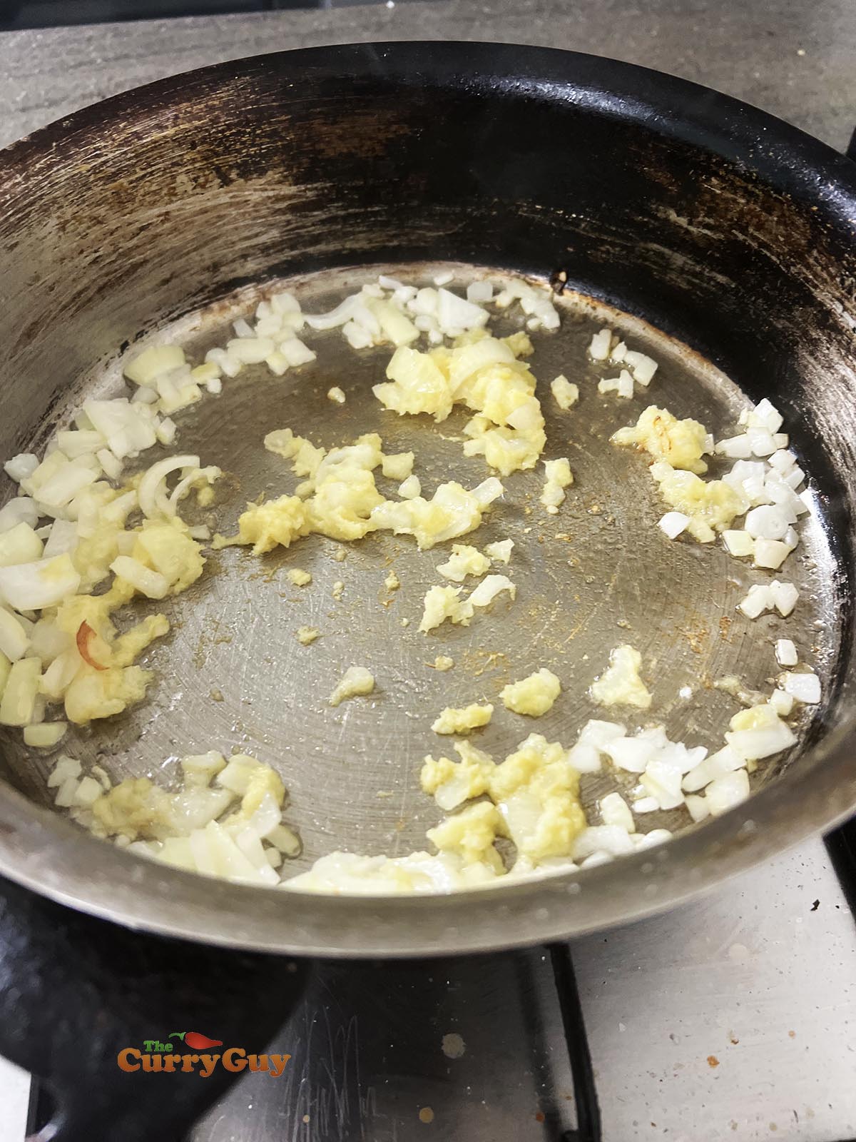 Frying onion, garlic and ginger