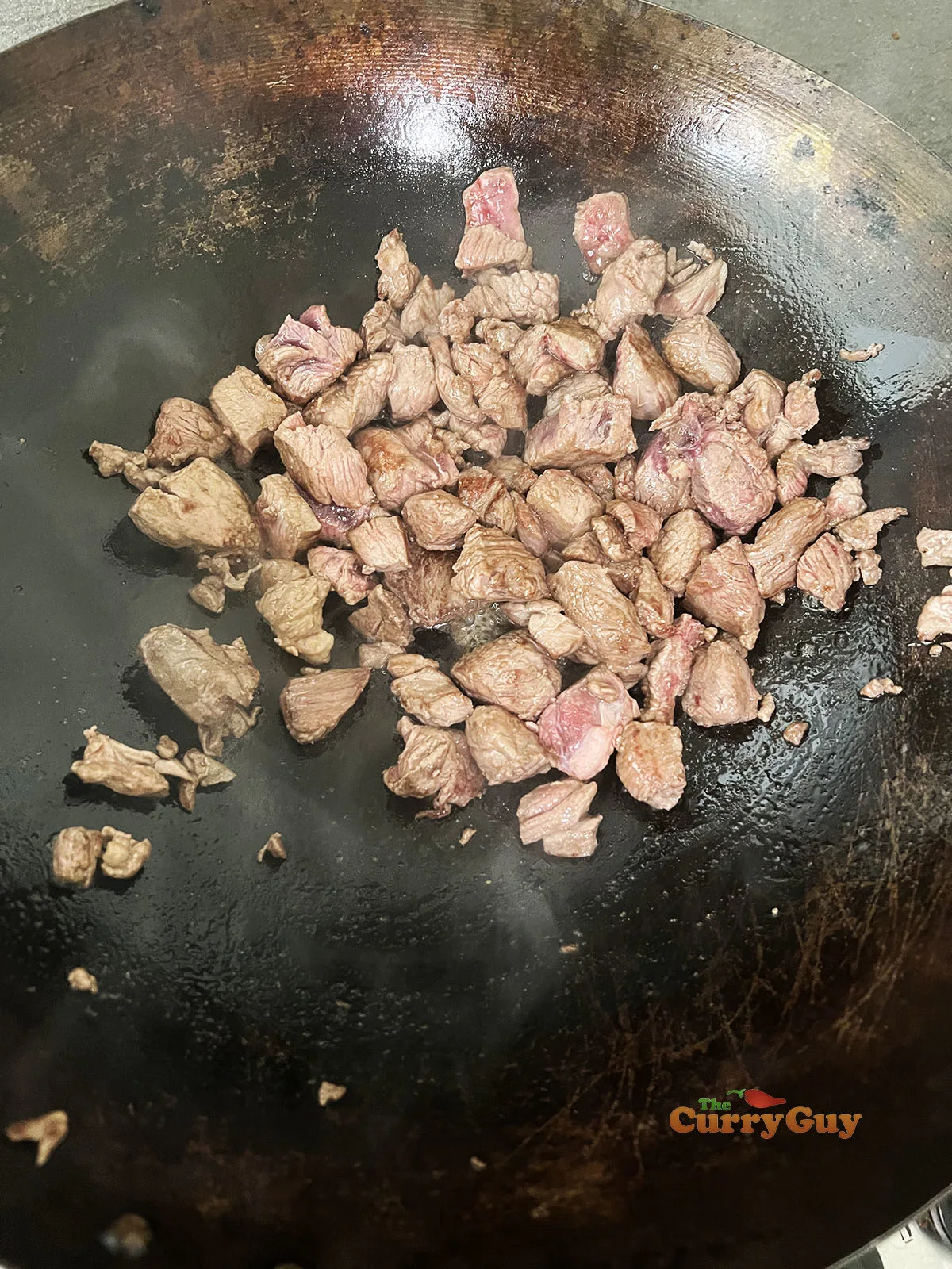 Browning meat in the wok