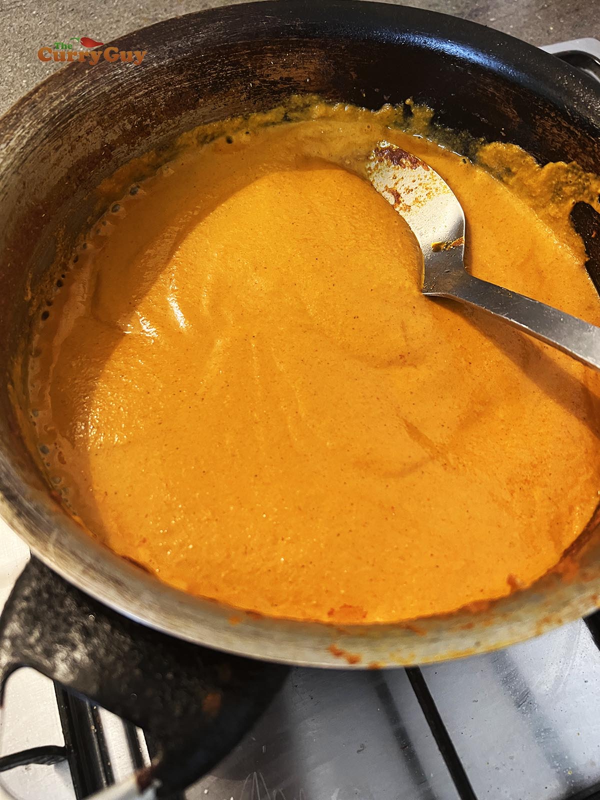 Returning blended sauce to the pan
