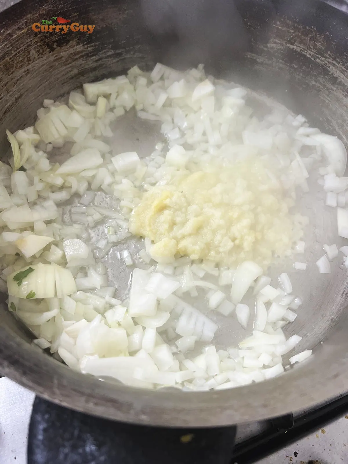 Frying onions, garlic and ginger in the pan