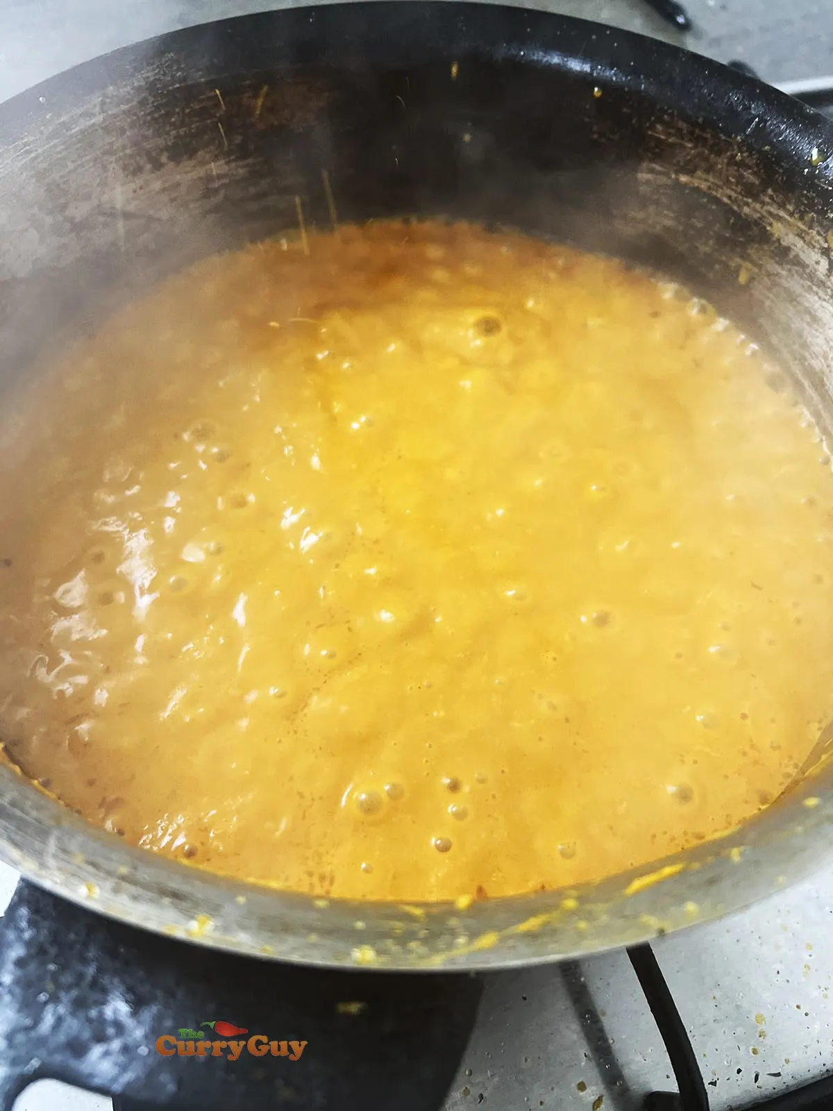 Pouring blended sauce back into the pan