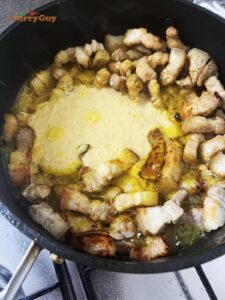 Adding raw sambal to the pan