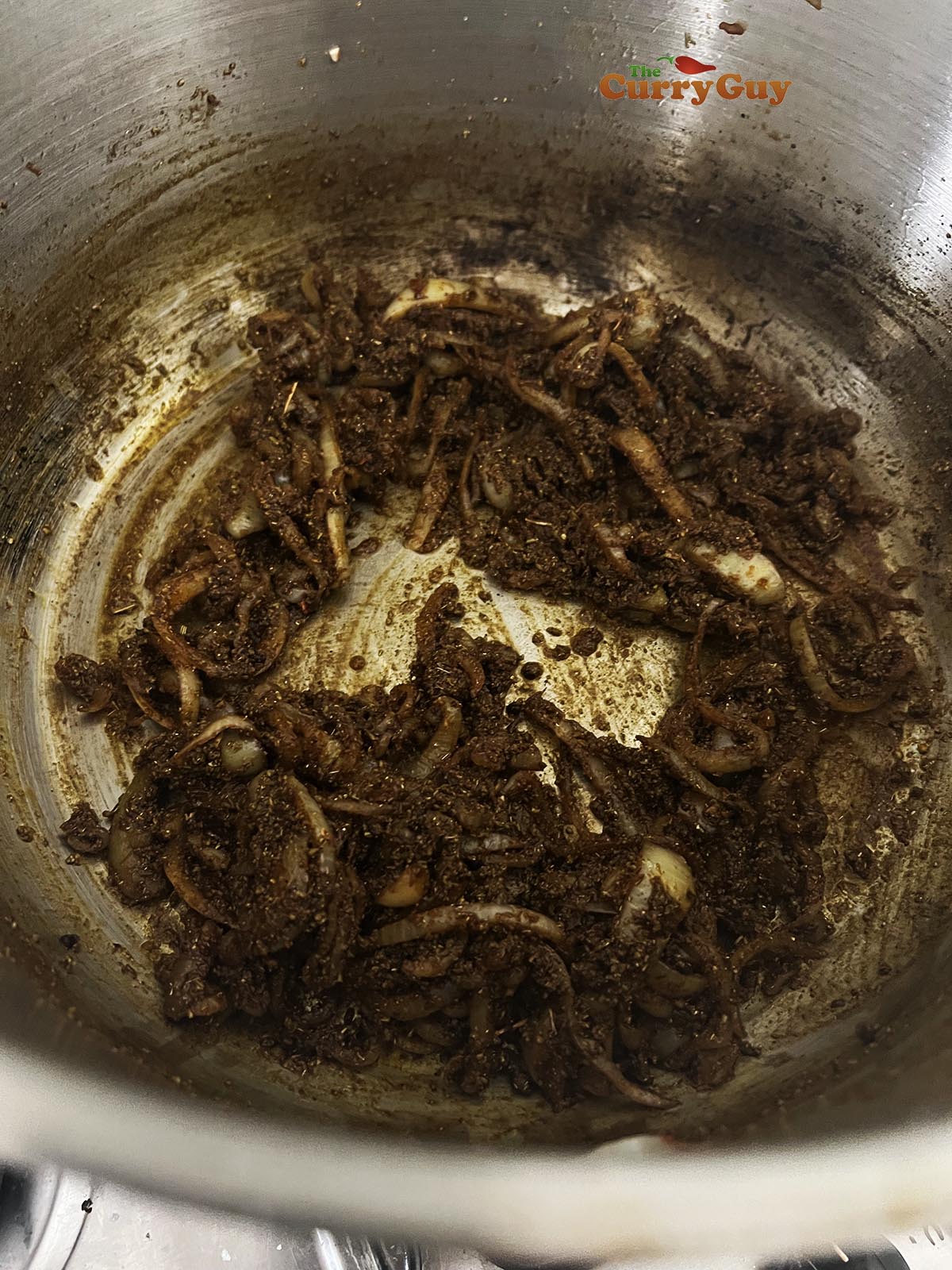 Ground spices stirred into fried onion.