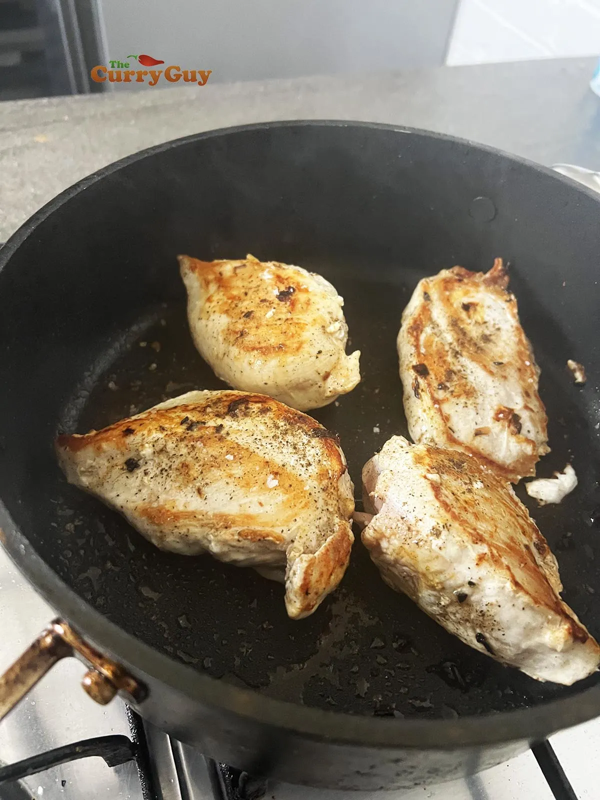 Frying chicken in a pan