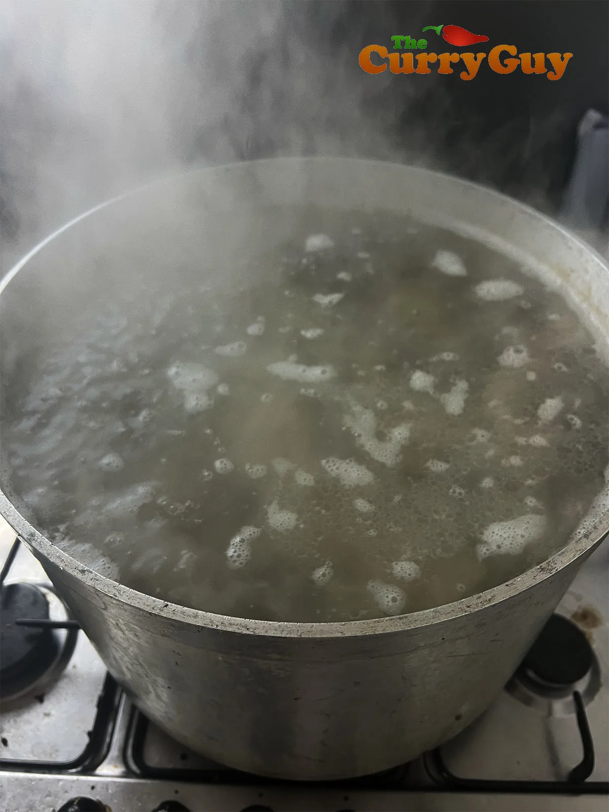 bringing pork bones to a boil