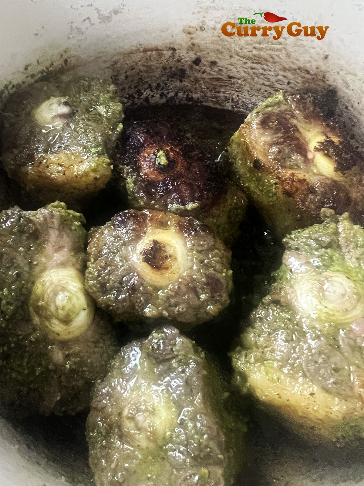 Frying the oxtail.
