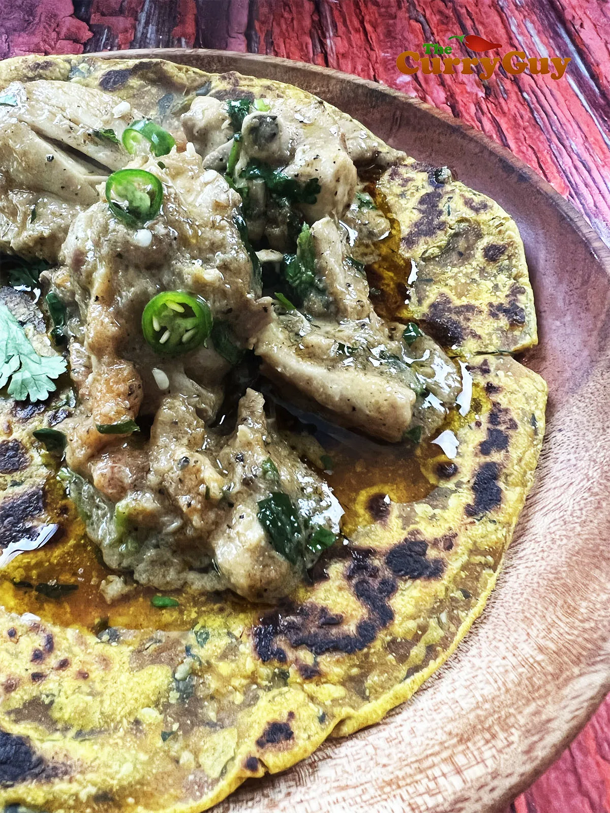 Place pepper chicken karahi served on a chapatti. 