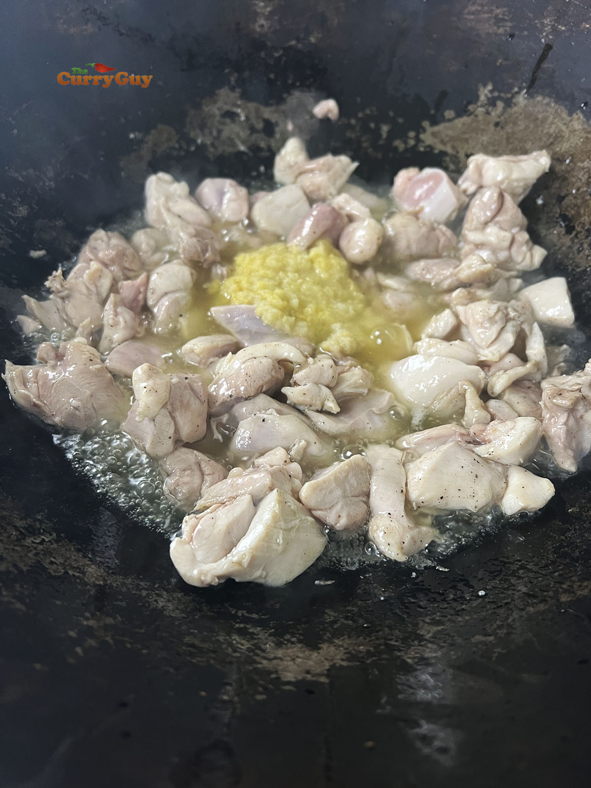 Adding garlic and ginger paste to the pan.