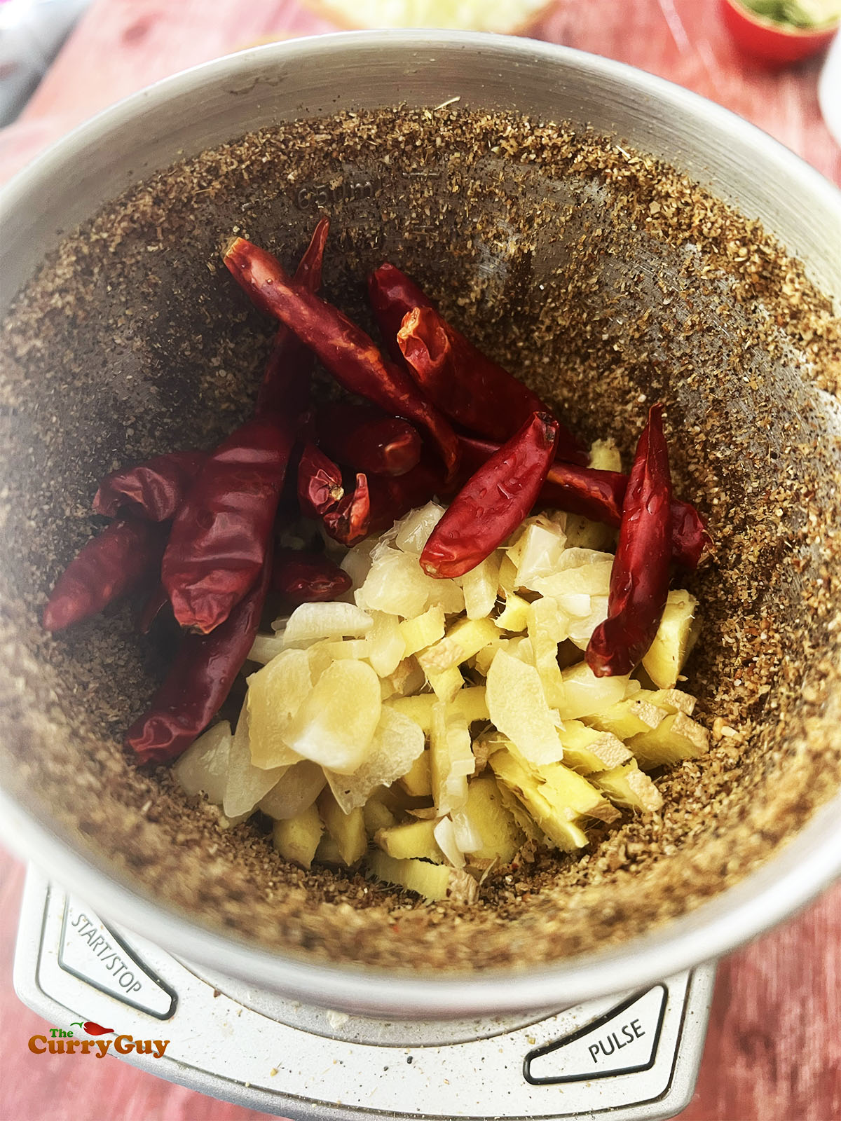 Adding the garlic, ginger and soaked chillies.