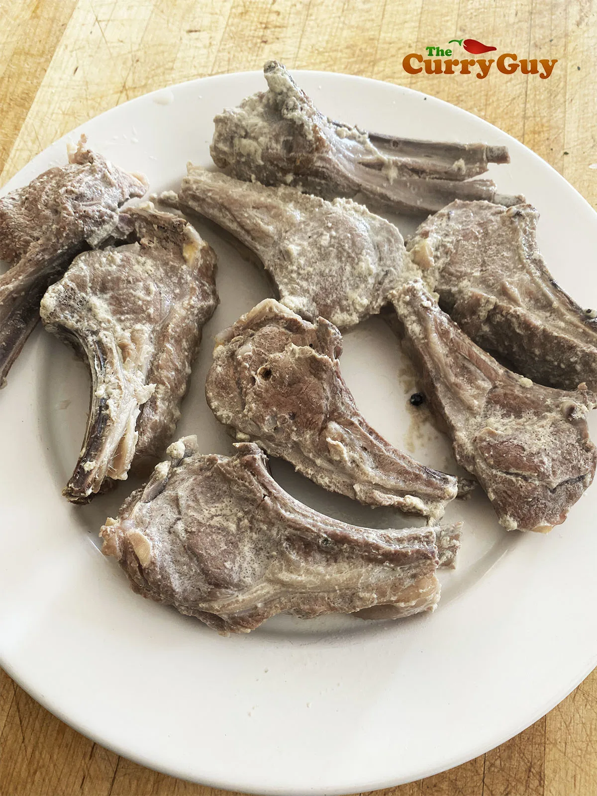 Lamb chops after being simmered. Patted dry.