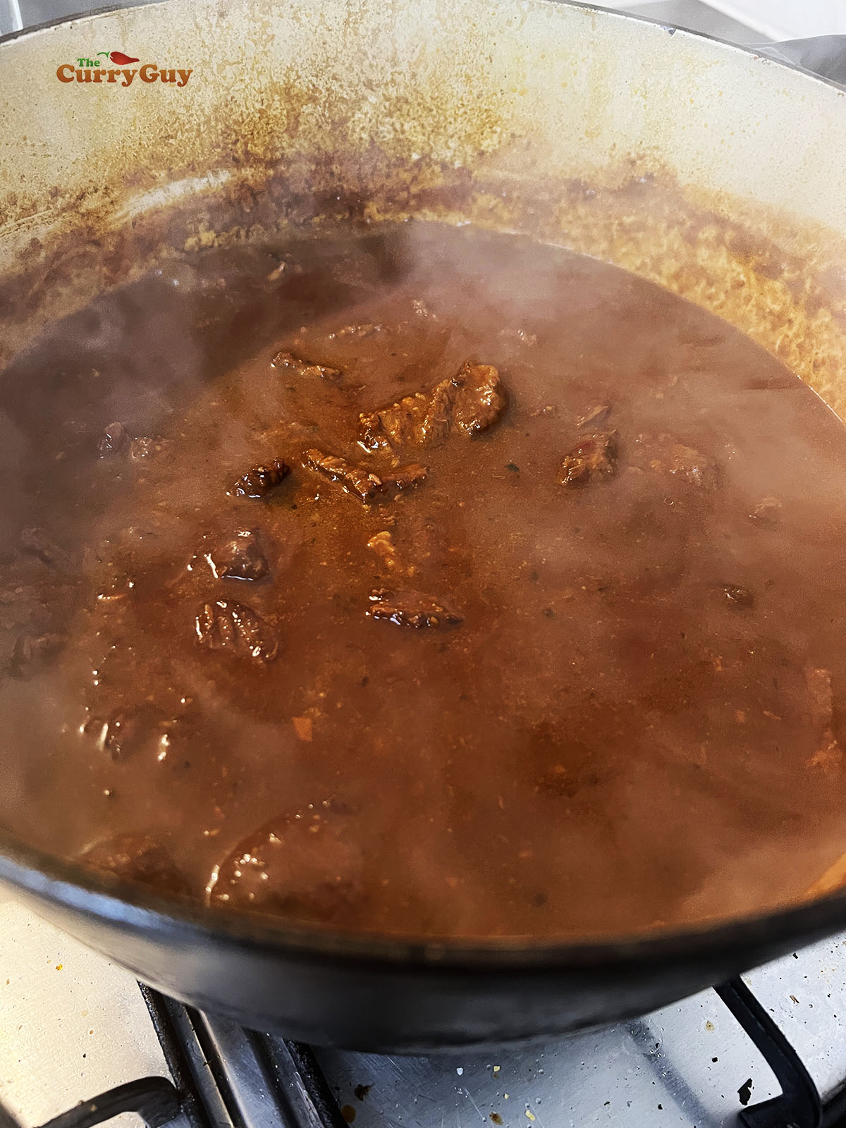 Texas chili simmering to thicken.