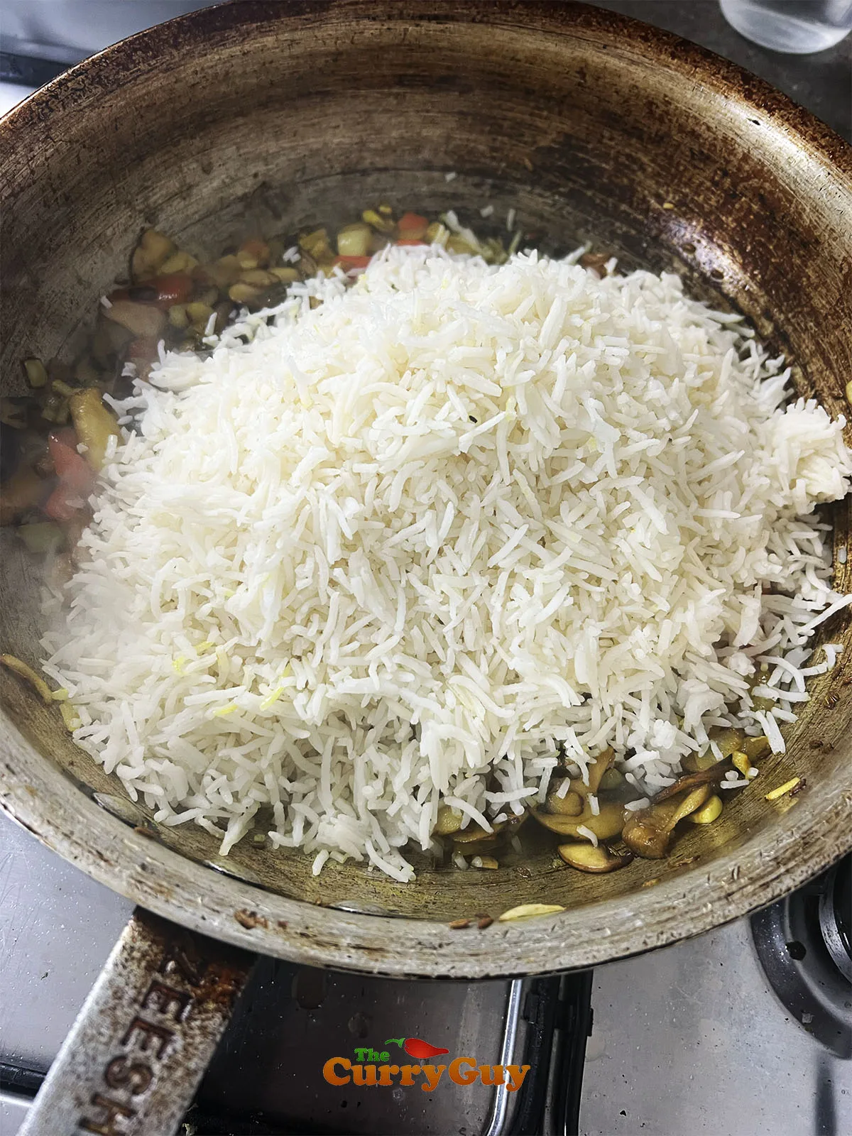 Adding the cooked rice.