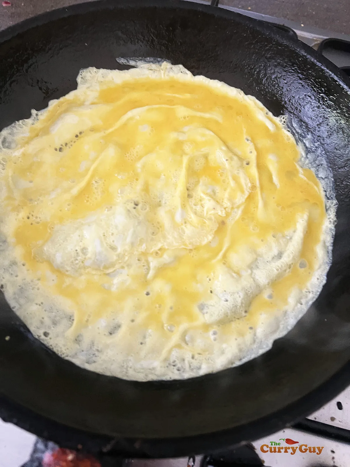 Egg cooking in a pan.