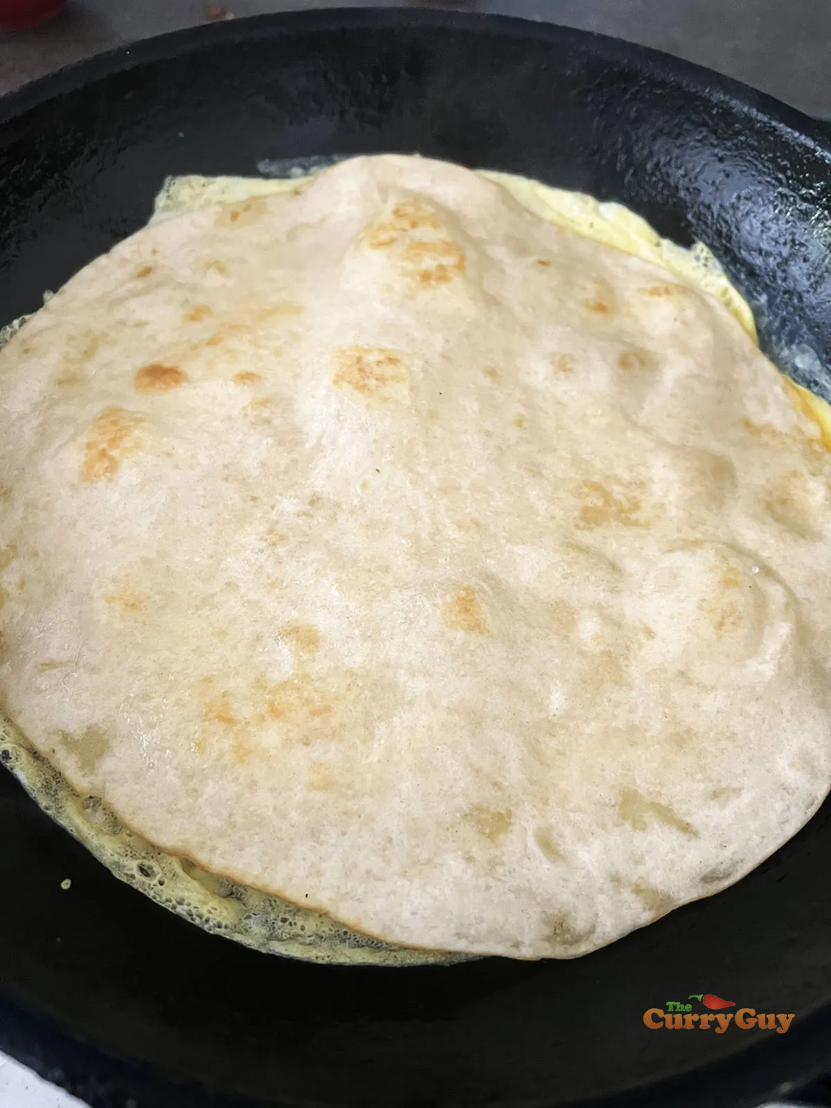 Tortilla on top of fried egg.
