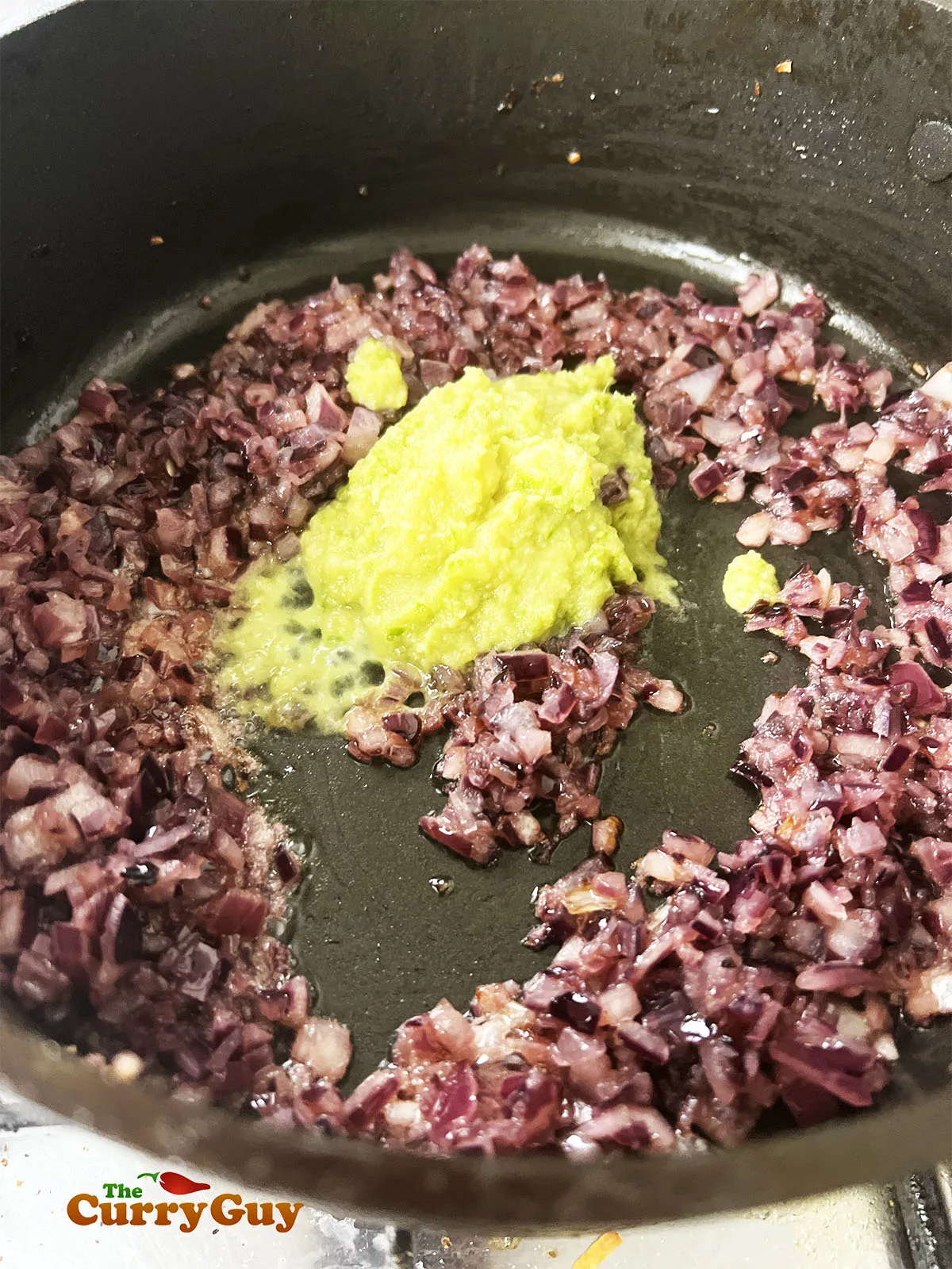 Frying the onions, garlic, ginger and chilli.