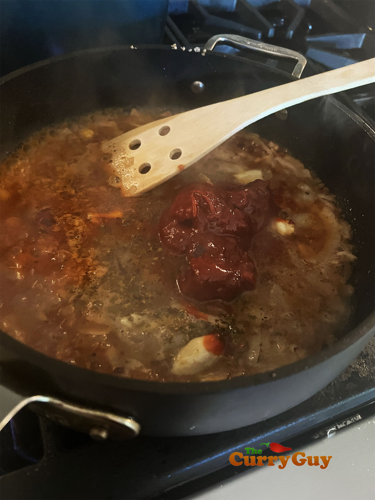 Simmering the sauce to make the paste.