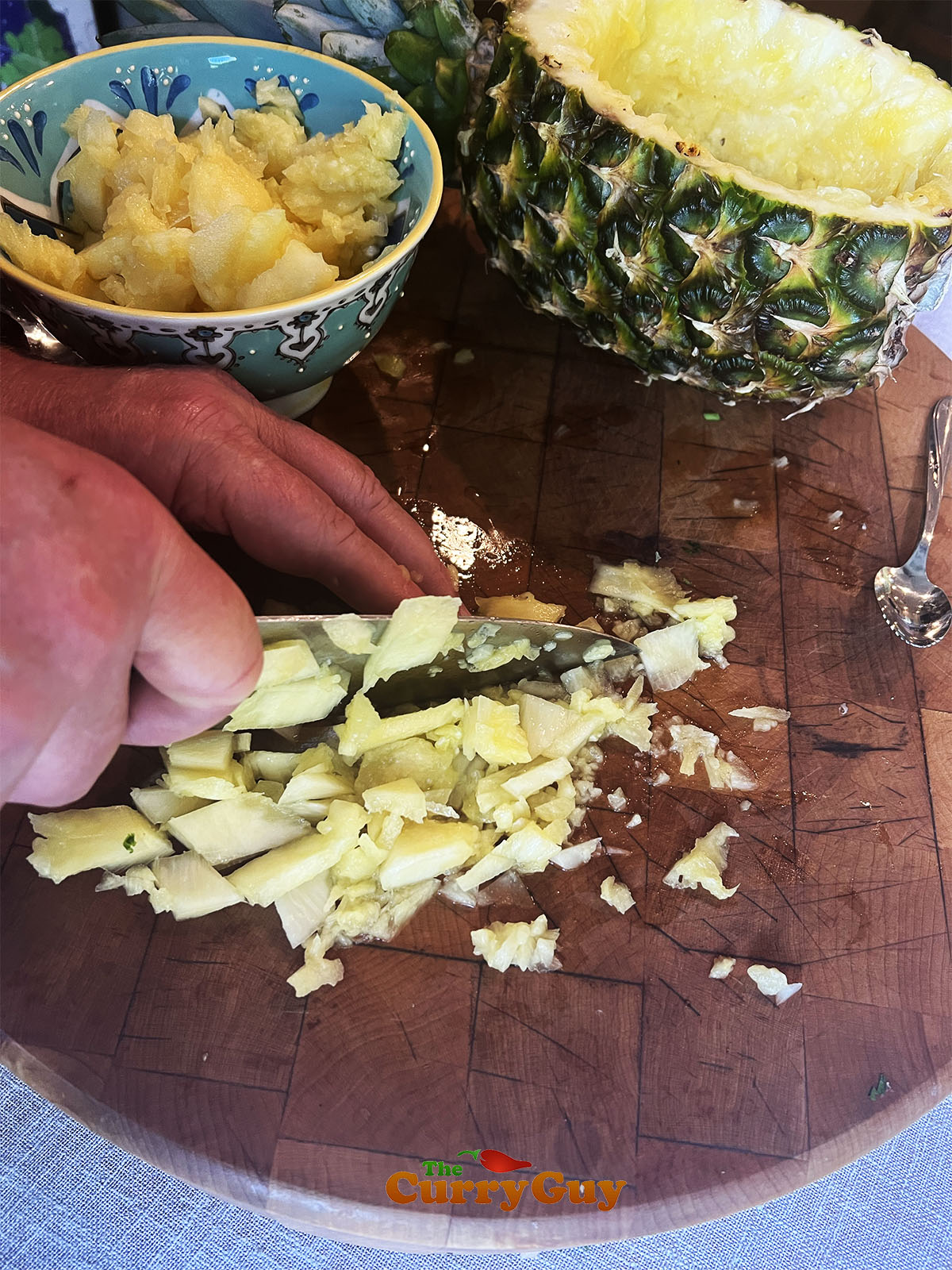 Slicing pineapple into small dice for the salsa.