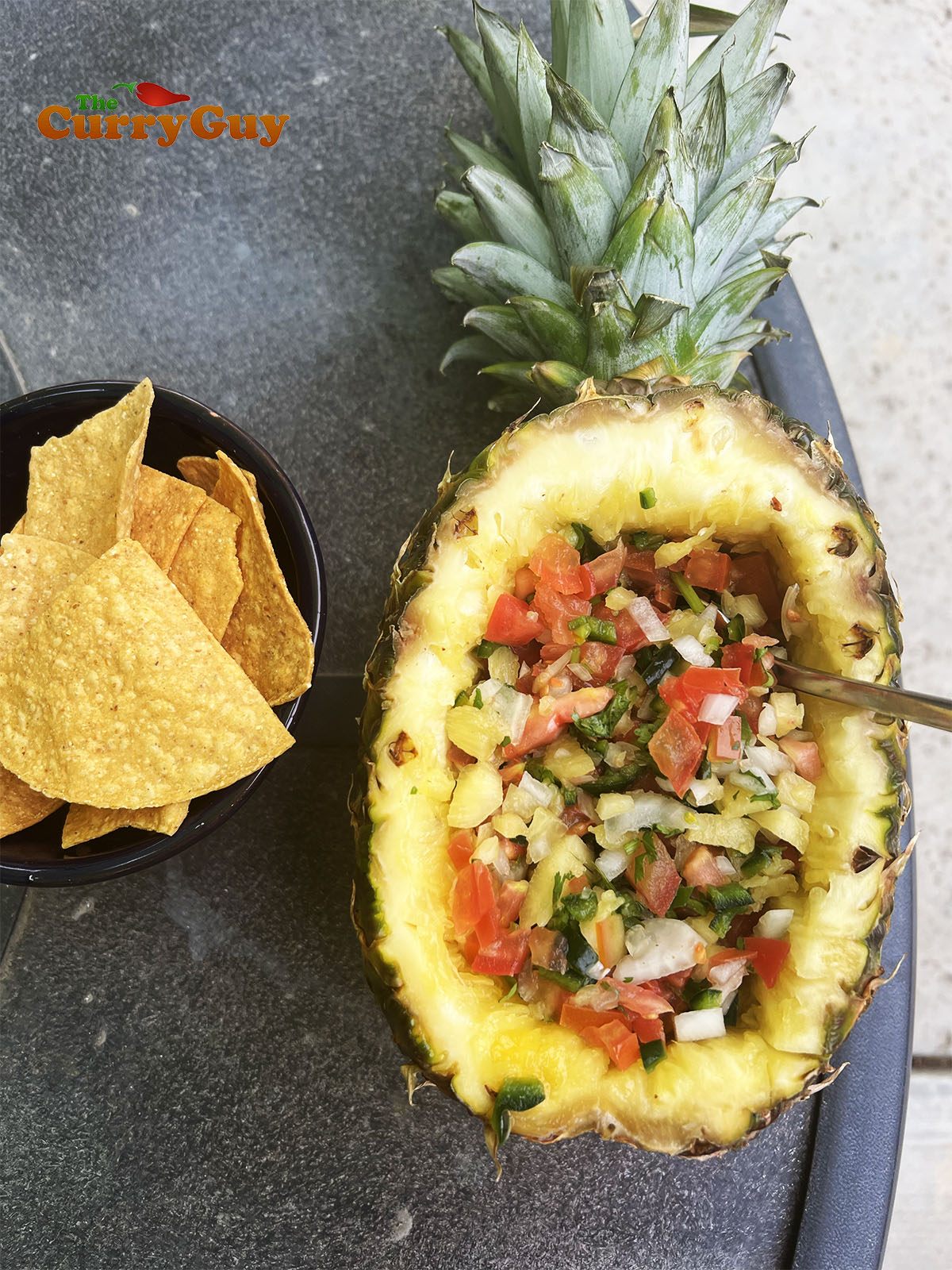 Pineapple salsa served in a hallowed out pineapple.