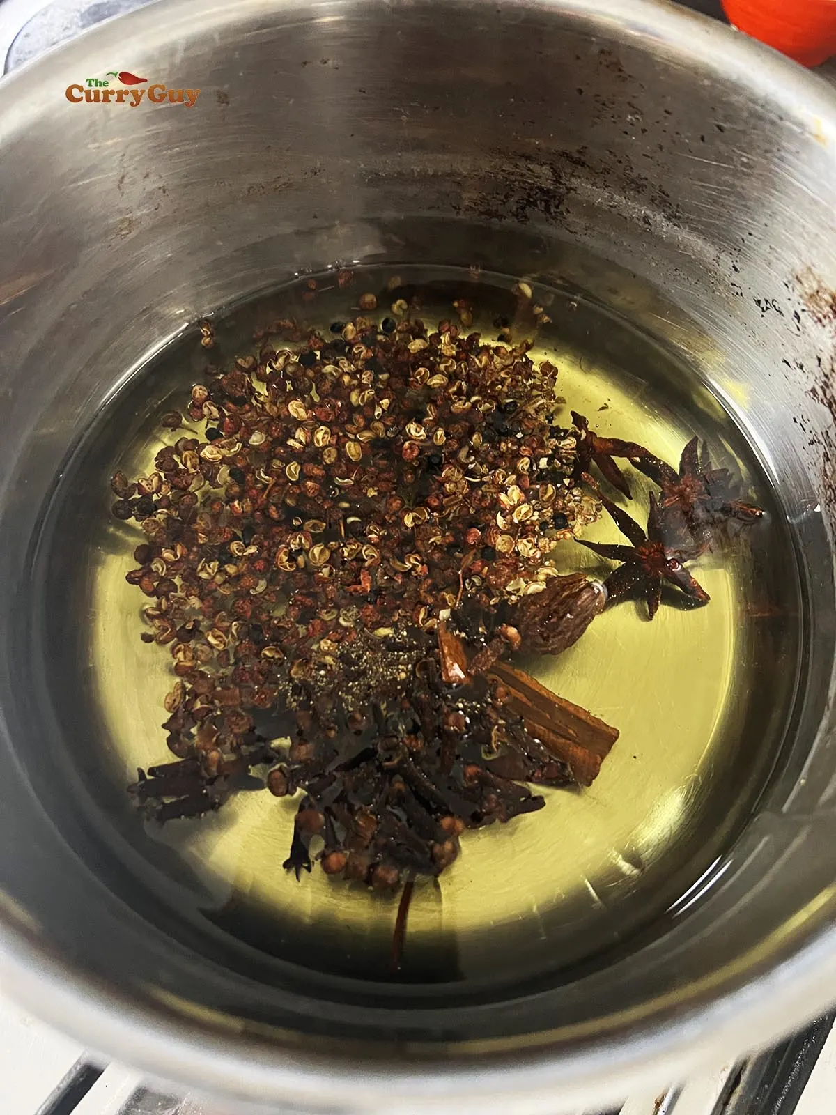 the whole spices in oil over a medium-high heat in a pan.