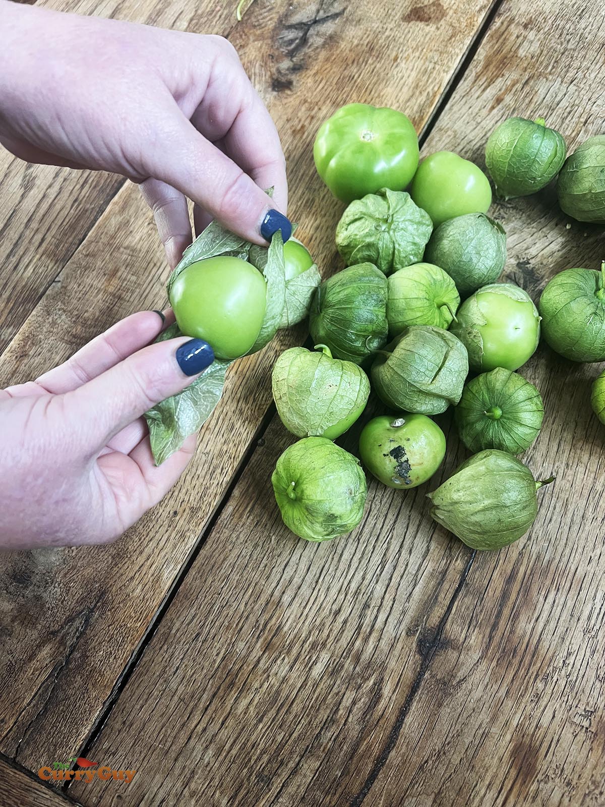 Removing the husks from the tomatillos