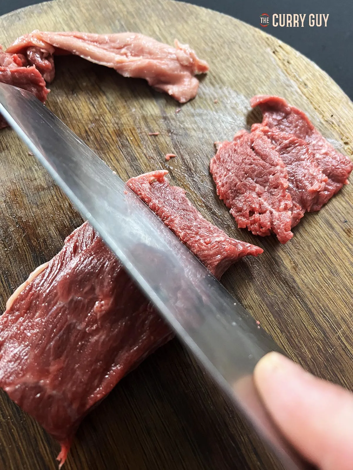 Slicing meat against the grain.