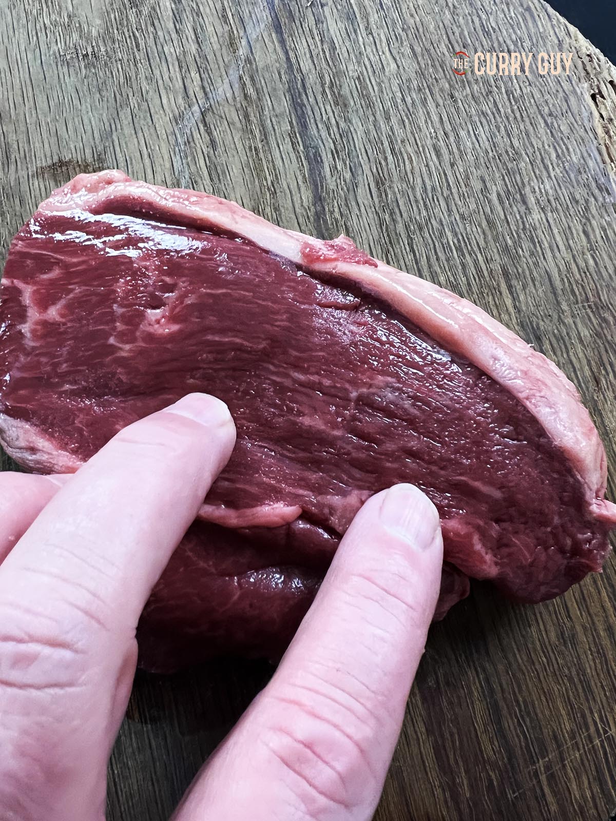 A photo showing the grain in a beef rump steak.