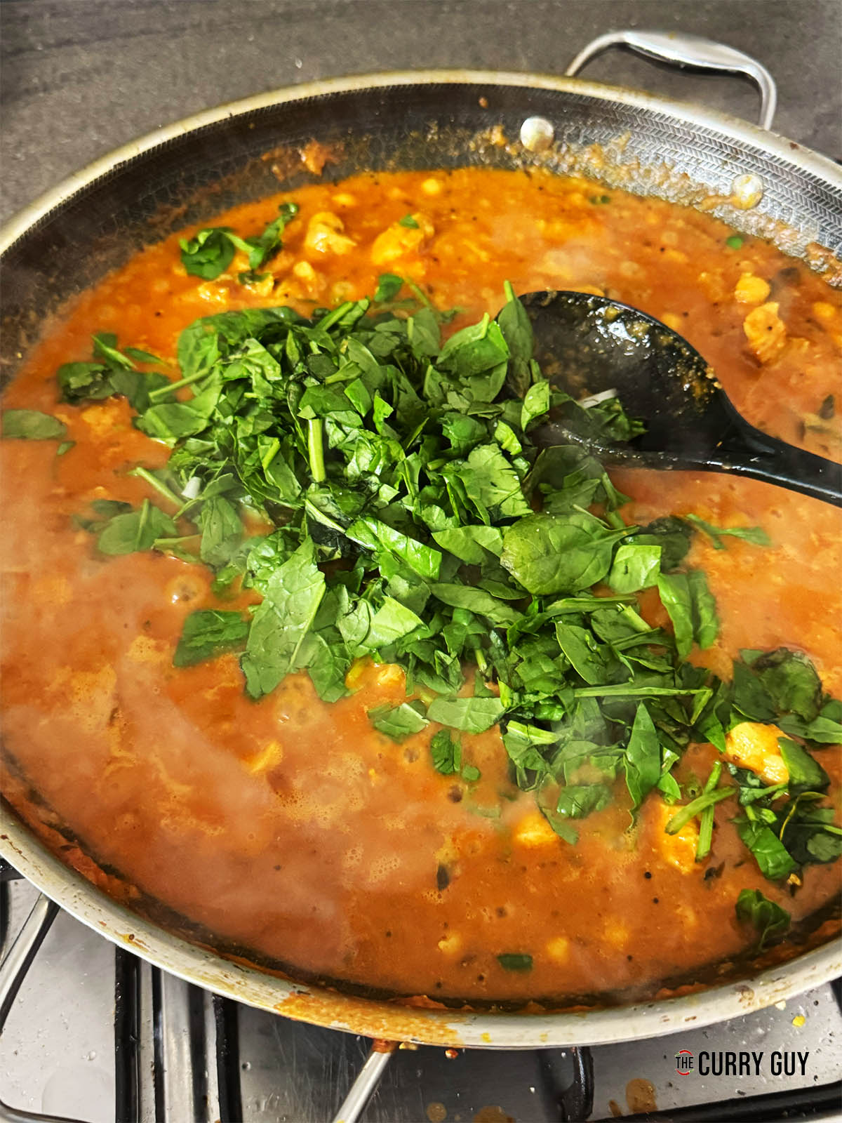 Adding the spinach.