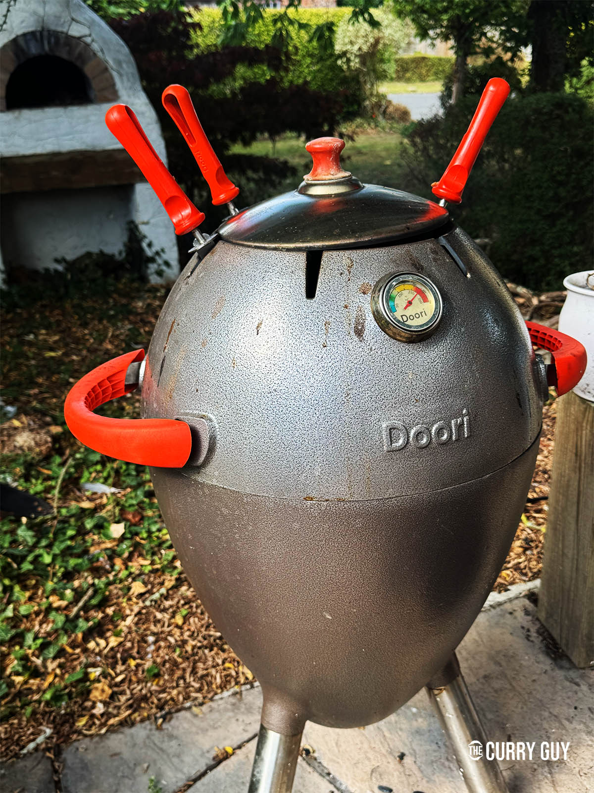 Cooking the kebabs in the hot tandoor.