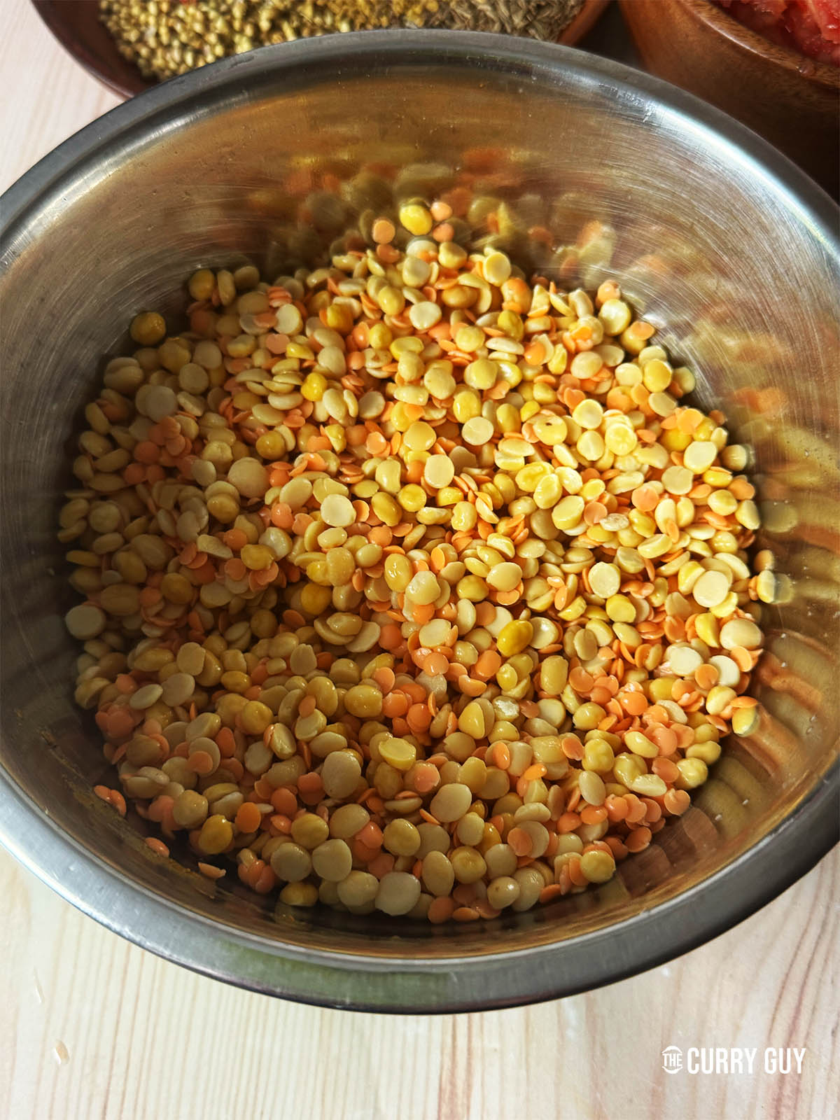 The dal that has been soaked for four hours in water, ready to cook.