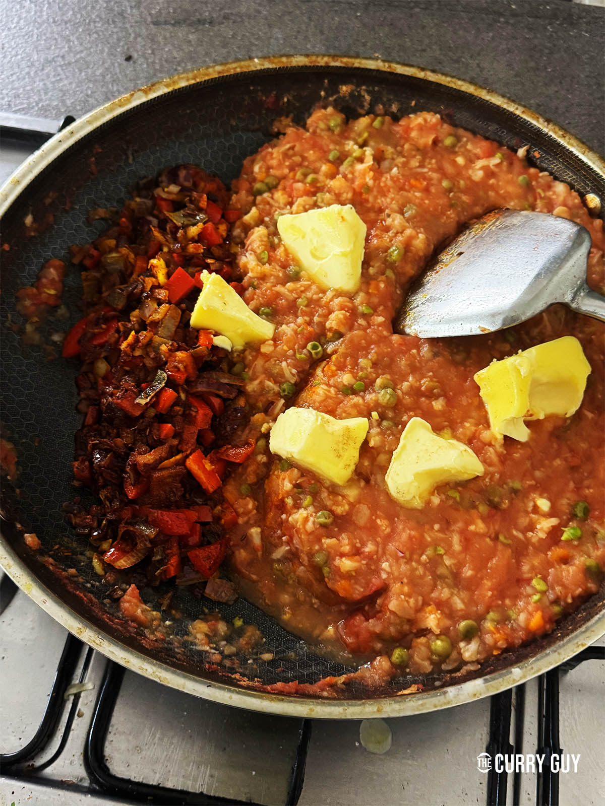 Mixing the vegetables together and adding butter.