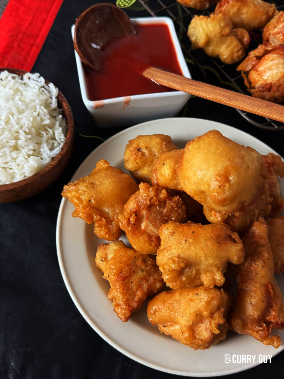 Chinese chicken balls with sweet and sour sauce served at the table.