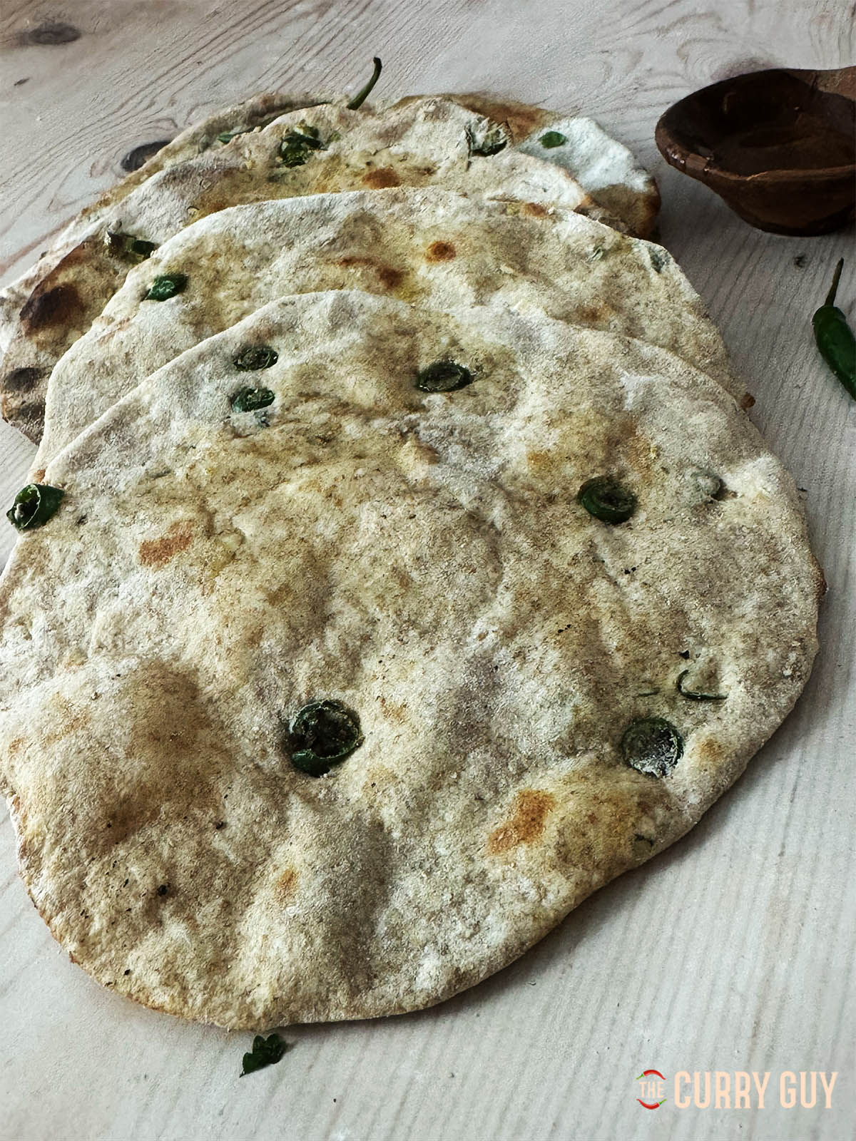 Chilli garlic tandoori roti on a counter top.