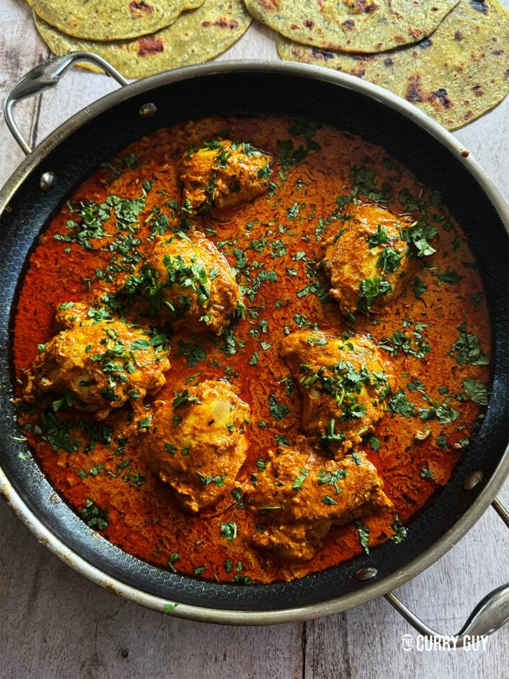 Dahi chicken curry in the pan it was cooked in.