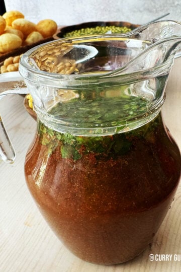 Tamarind water in a pouring jug.